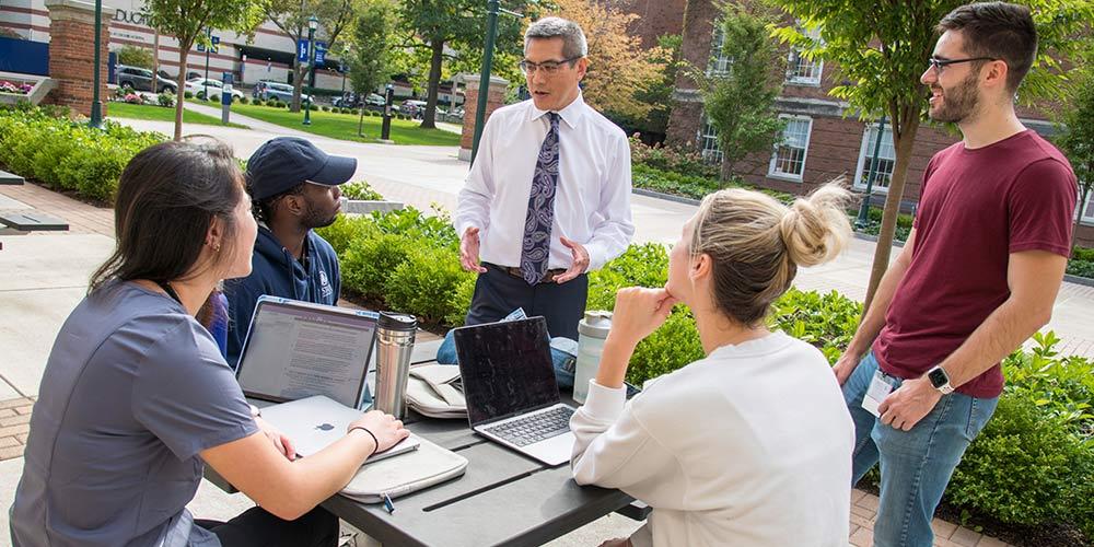 Dr. Larry Chin with students