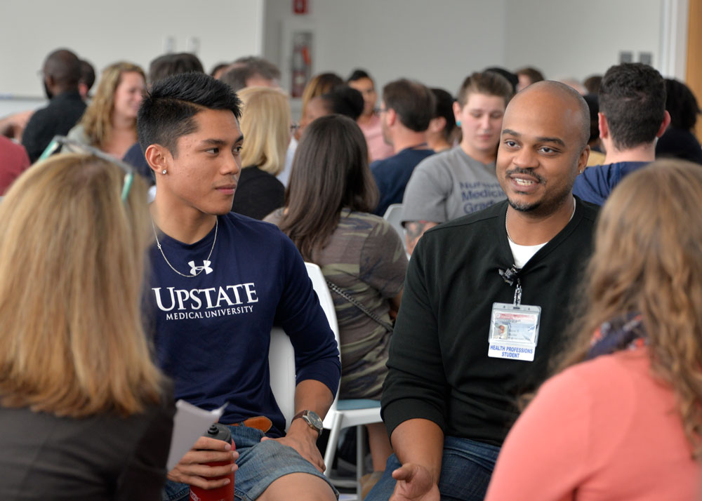 Students conversing in classroom setting