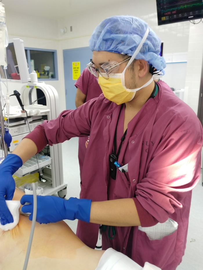A resident working in the OR