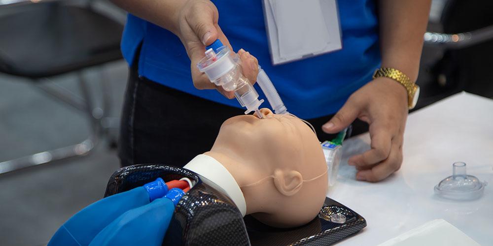 Student practicing airway management techniques