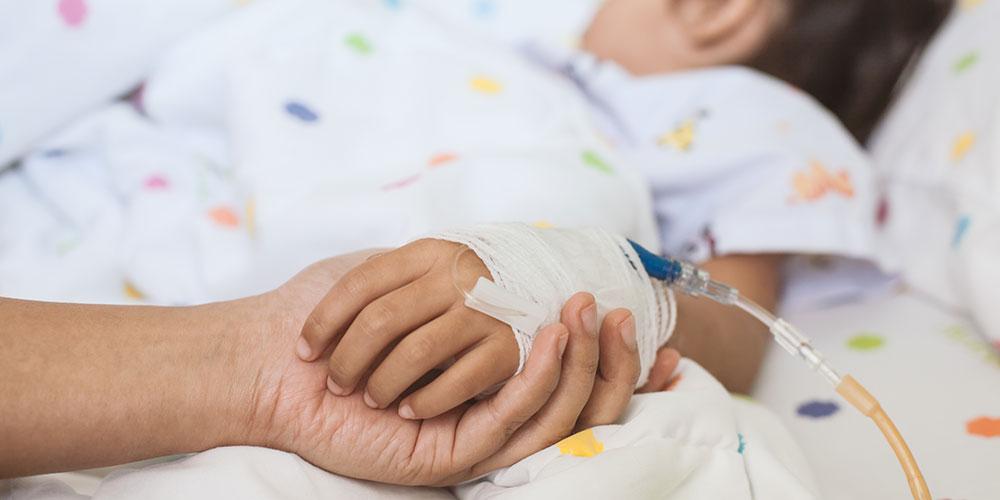 Child with parent holding hand