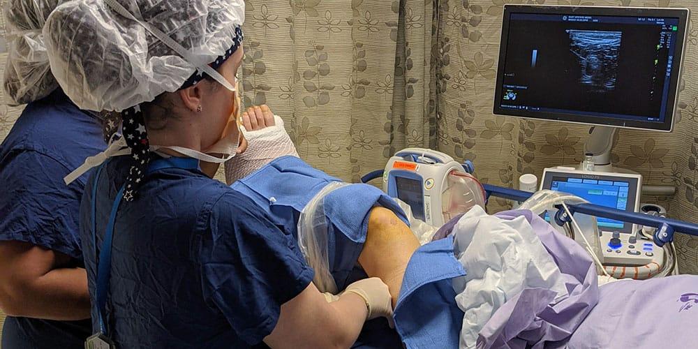 Students practicing anesthesiology techniques