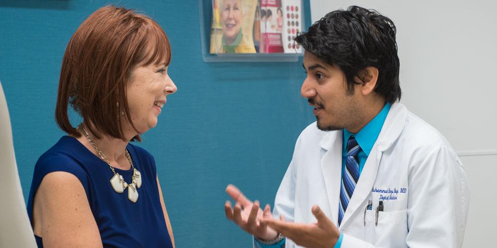 Dr. Naqvi with patient