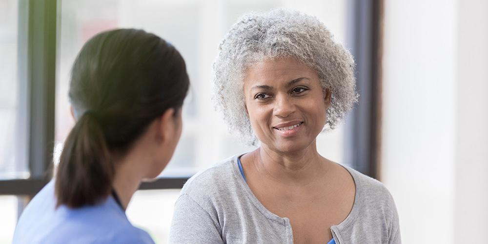 senior woman listens as doctor gives advice
