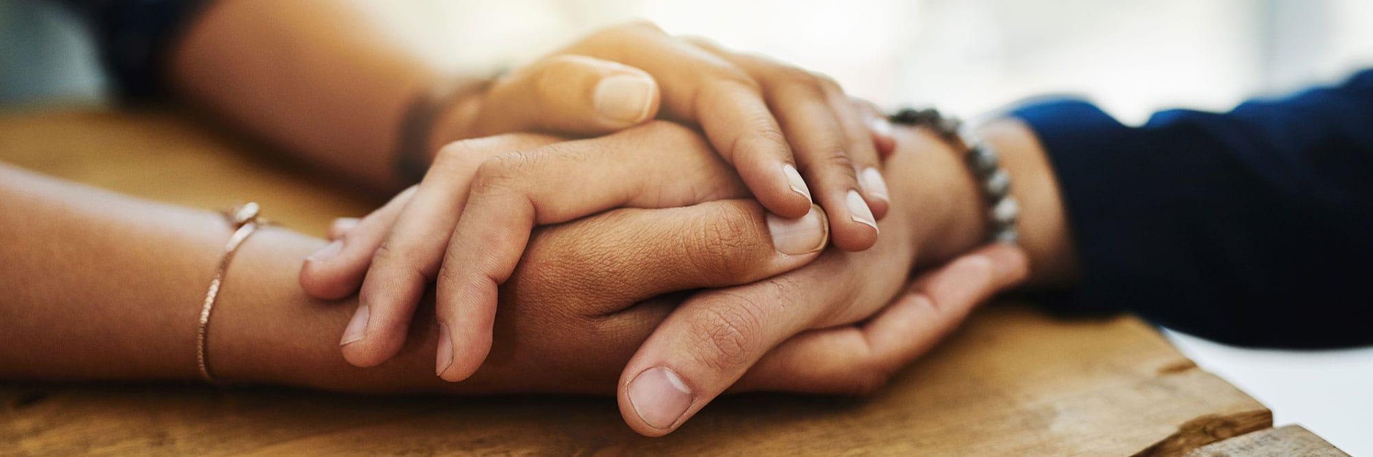 Holding hands in support
