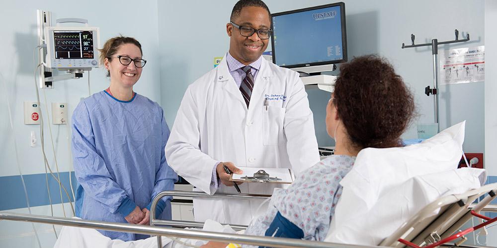 Dr. Sekou Rawlins with patient