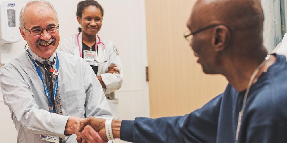 Dr. Graziano, greeting a patient