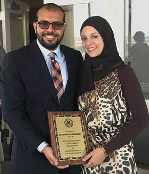 Dr. Mahmoud and spouse receiving award