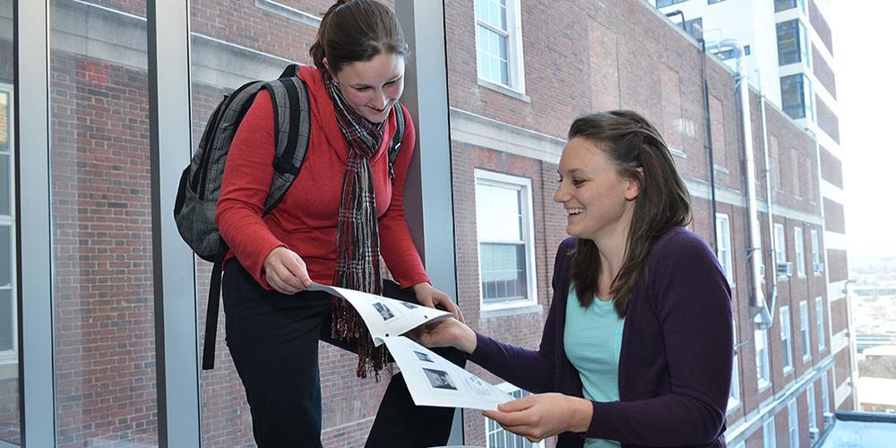 Two students comparing notes