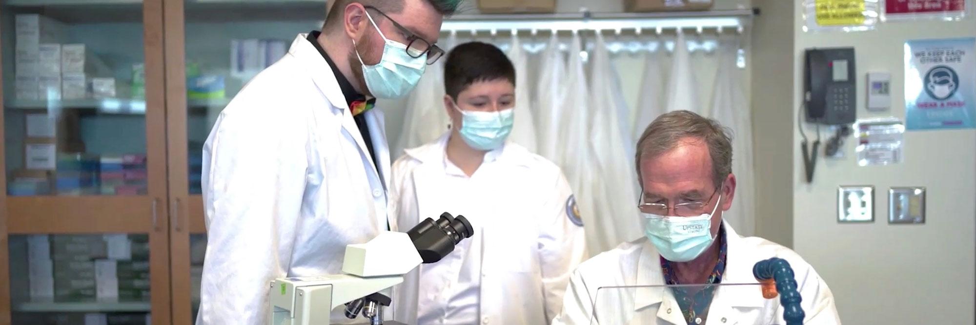 Students along with Dr. James Vossler in lab