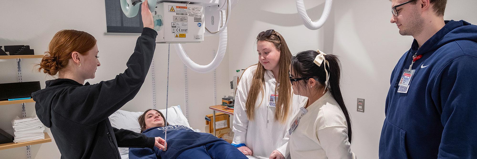Medical Imaging - Radiography students practicing on x-ray equipment