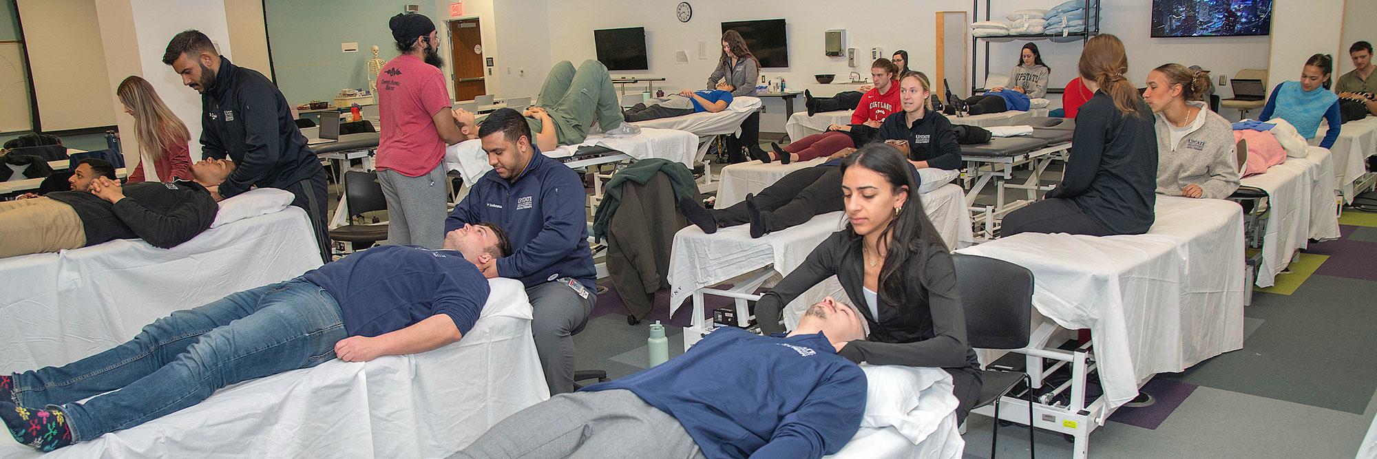 Physical Therapy students practicing techniques on fellow students