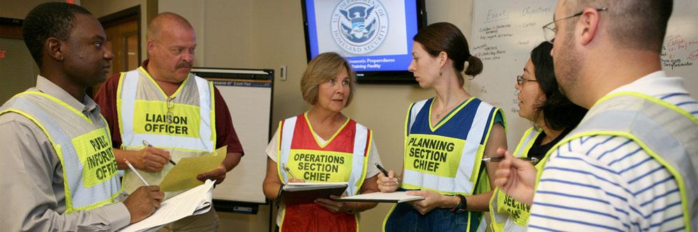 Deborah French, the director of emergency preparedness for the Colorado Hospital Association (CHA), identified above as the operations section chief, updates other members of her team during her final exercise at the CDP. (Credit: FEMA)