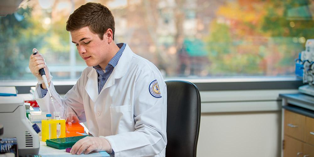 student in research lab