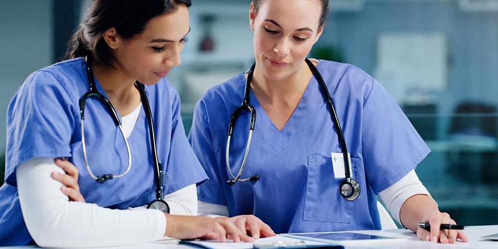 Nurses reviewing chart