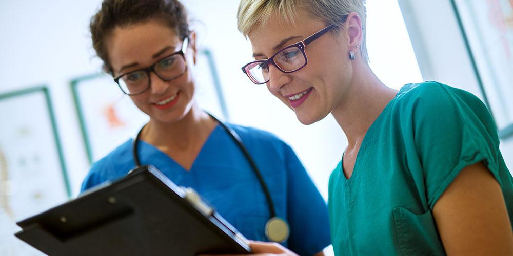 Nurses reviewing a chart