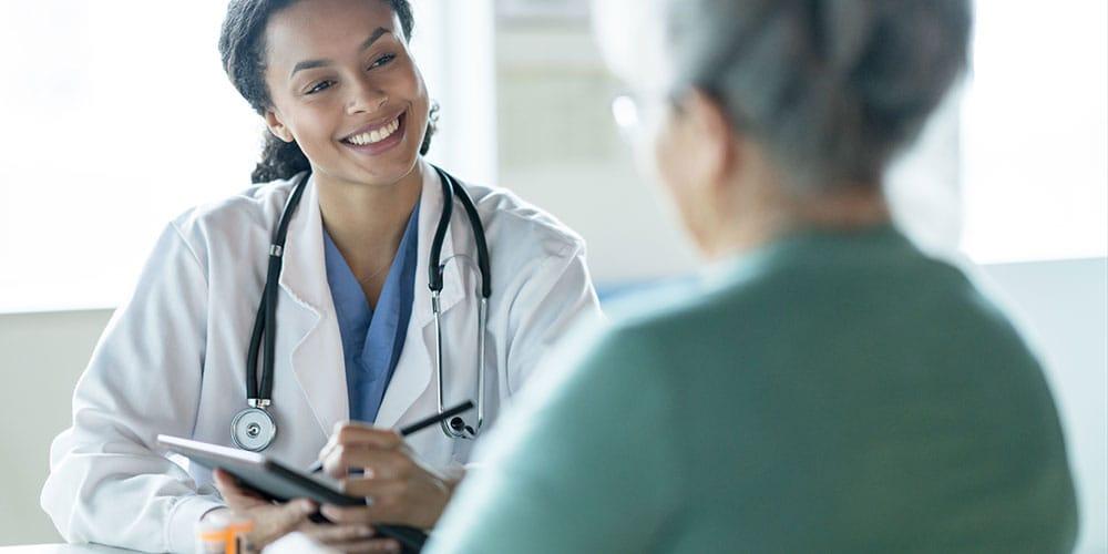 Nurse with older patient