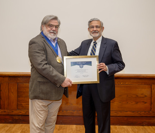 William J. Brunken, PhD (Pictured Left) and Dr. Mantosh Dewan, President of Upstate Medical University (Right)