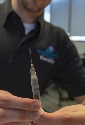 EMS student prepares a syringe