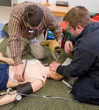 students working with mannequin