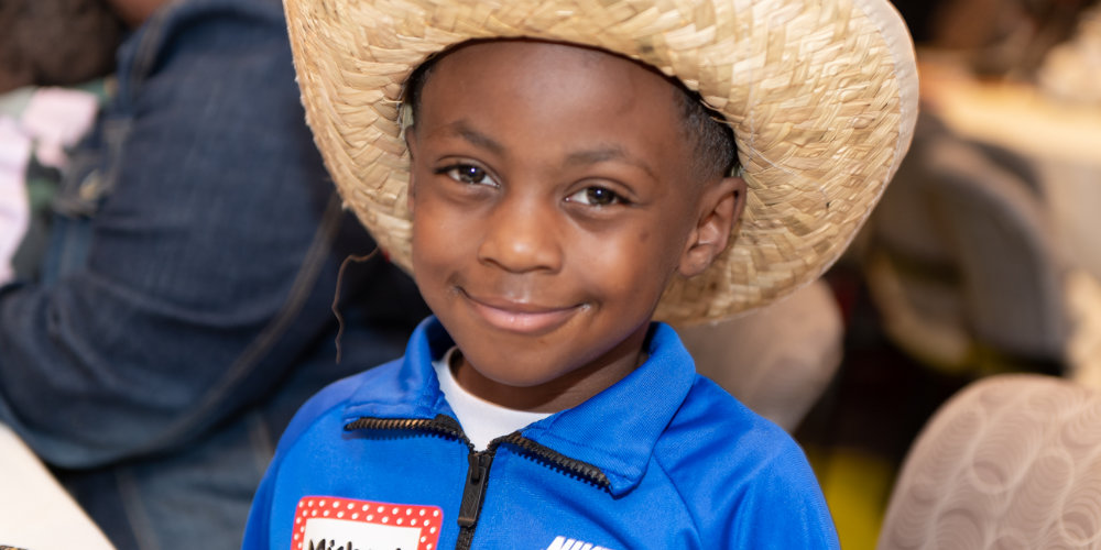 Child wearing hat at Sickle Cell event