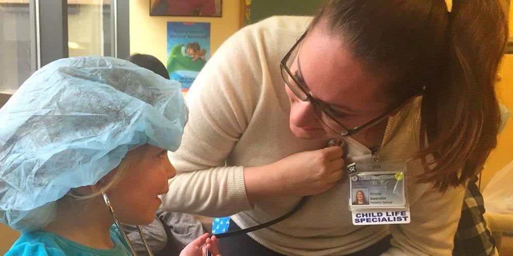 child life goals: child life specialist with patient