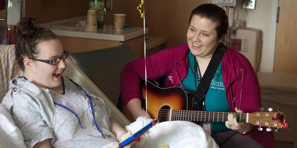 music therapy: child life specialist with patient