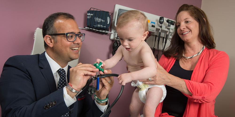 peds gi doctor with mother and young patient