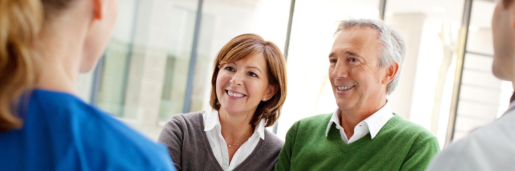 A man in woman in discussions with providers