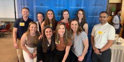 Upstate Community Advance Practice Providers smile in front of backdrop.