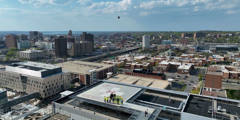 Drone delivery to the Chancellor over the Syracuse skyline