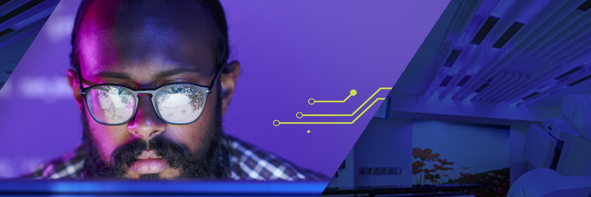 Man at computer in high tech health care setting