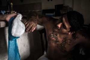 A man in Machala, Ecuador, looks at a sample of mosquitos collected by researchers collaborating with Upstate's Anna Stewart Ibarra, PhD