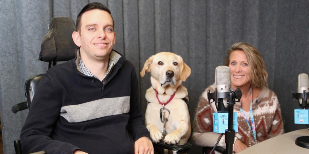 Connor McGough, his service dog, Topper, and Erin Wentz, PhD. McGough is the adaptive design program coordinator for ARISE, and Wentz is an assistant professor of physical therapy at Upstate (photo by Jim Howe)
