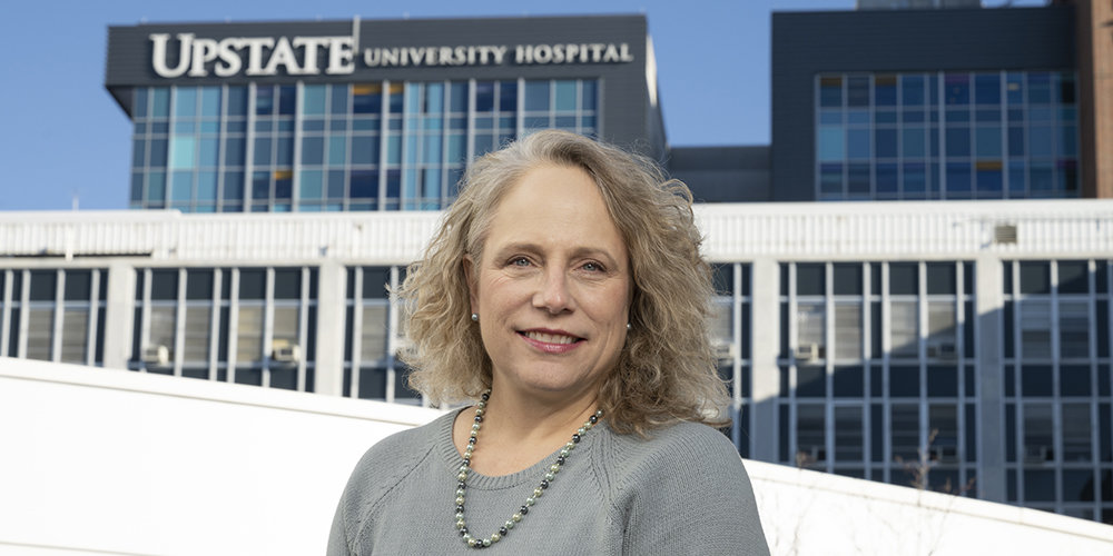 Amber Smith in front of Upstate buildings