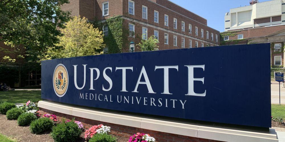 Upstate Medical University sign in front of Weiskotten Hall