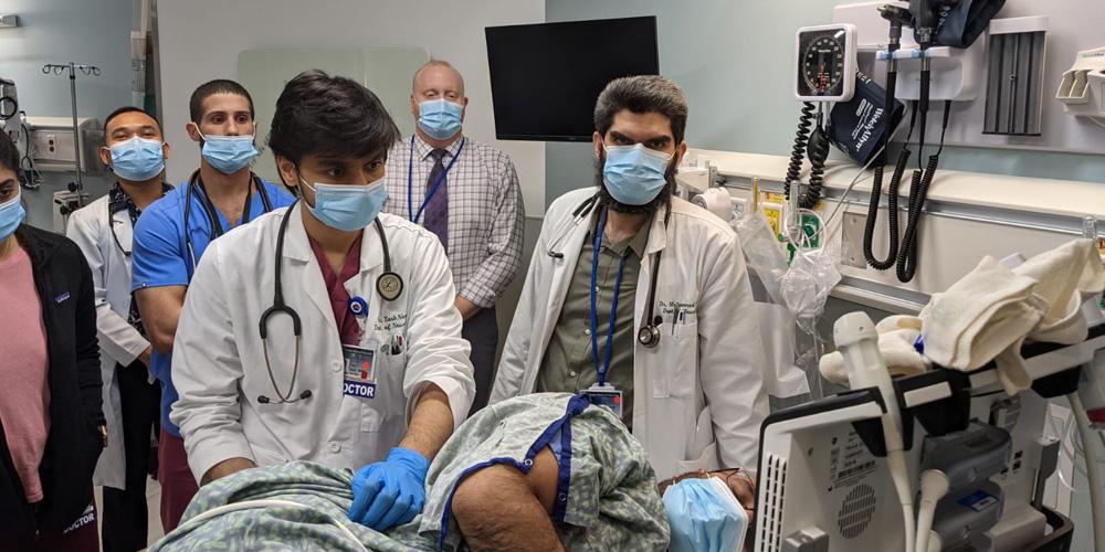 Residents working with Doctors.