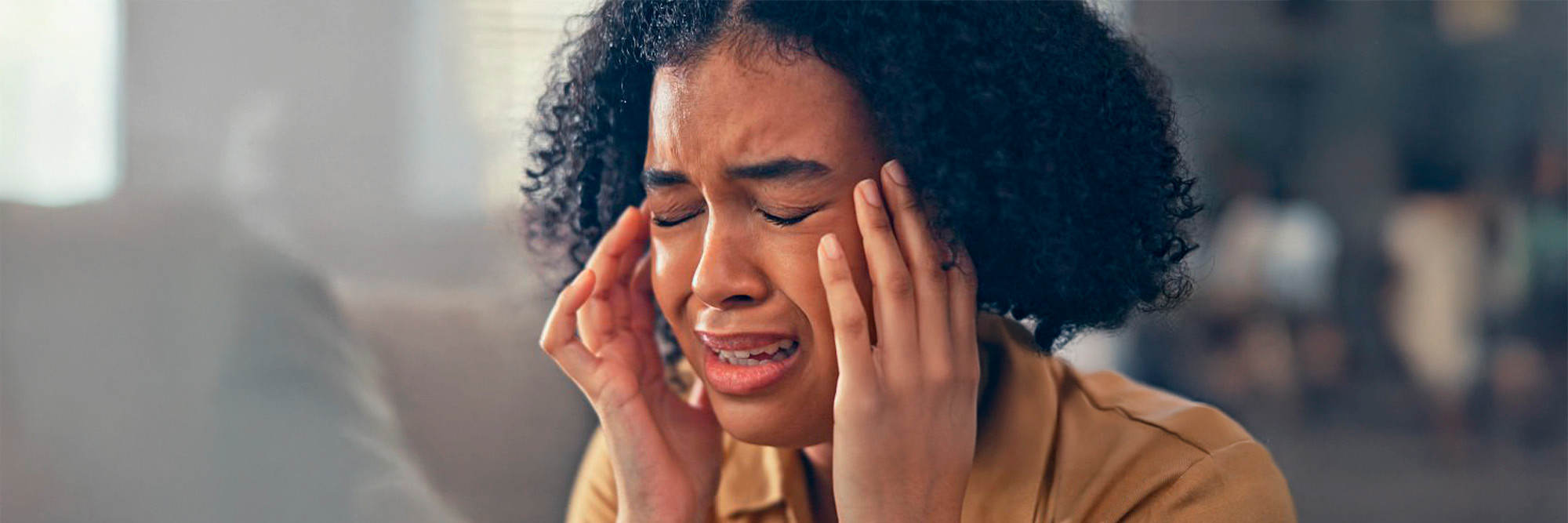 Women suffering facial pain.
