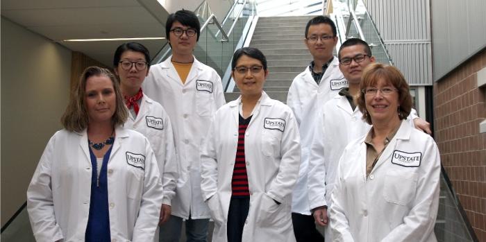  Photography of the Neurosurgery Research Team led by Dr. Li-Ru Zhao. Photographed from first appearance, left to right are Michele Kyle (left-end), Suning Ping, Xuecheng Qiu, Li-Ru Zhao (middle), Xingzhi Guo, Junchi He, Karen Hughes (right-end).