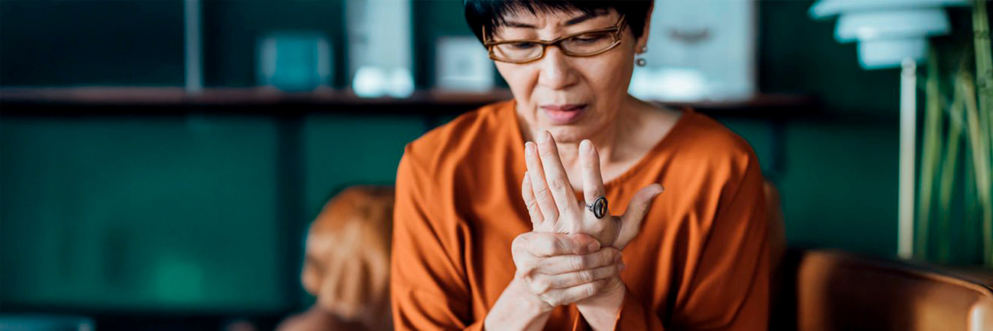 Asian women holding her hand