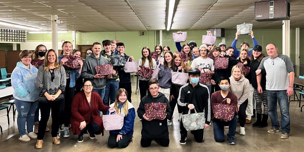 BEARING GIFTS: The confirmation class at Christ the Good Shepherd Parish in Oswego collected care items and filled bags for patients receiving care at Upstate Cancer Center as part of a project with the organization Thirty-One Gifts.