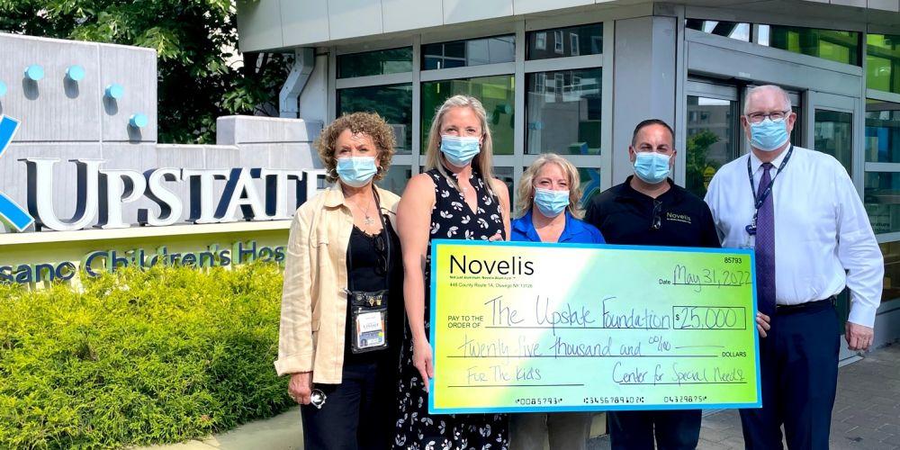A NOD FROM NOVELIS: Novelis presents a $25,000 gift to the Upstate Foundation to support the adaptive design workshops through the Golisano Center for Special Needs.