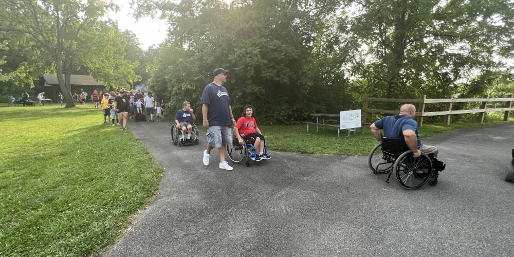 CELEBRATORY GATHERING: Family, friends and patients of the Upstate Spina Bifida Clinic get set to traverse the Erie Canal.The gathering was in celebration of the 33-year anniversary of the Americans with Disabilities Act.