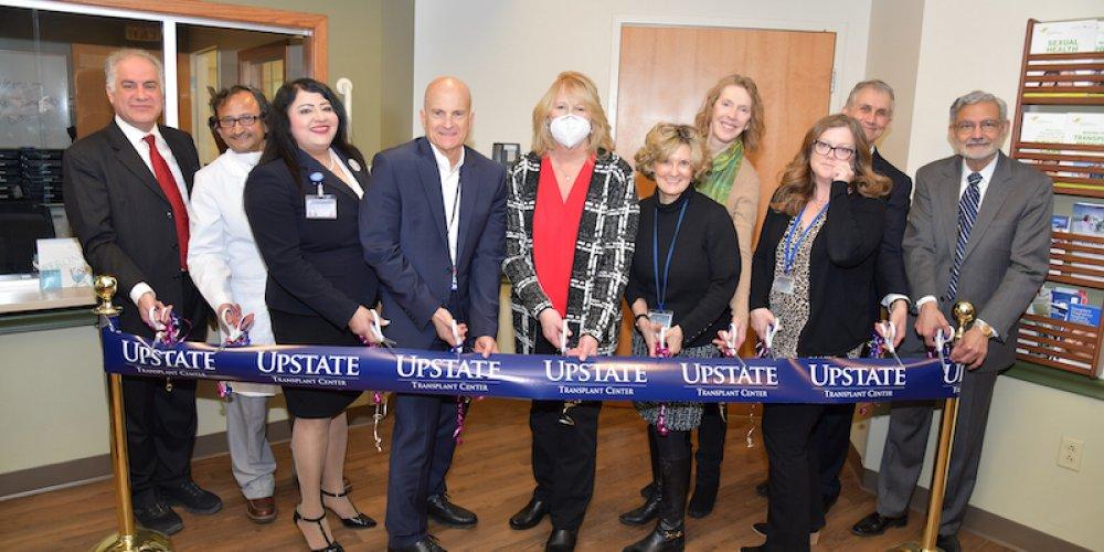 TRANSPLANT OPEN:  Upstate officials flank kidney transplant recipient Michelle Krukowski to cut the  ribbon officiallly opening the new location of the Upstate Kidney Transplant Center. Krukowski received her new kidney from altruistic donor who saw a plea for a kidney on social media. The new center is located at 550 Harrison Center.