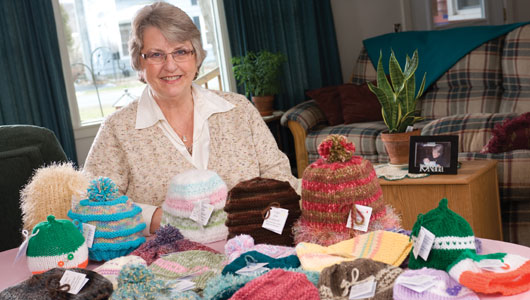 Cancer survivor Vicki Jellie knits caps for cancer patients
