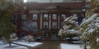 Early snow paints Weiskotten Hall courtyard white