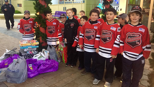 Area youth hocky team donates board games for kids