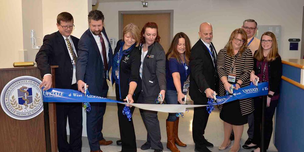 Hospital staff and administration cut the ribbon on the newly renovated western wing of the fourth floor at Upstate Community Hospital.