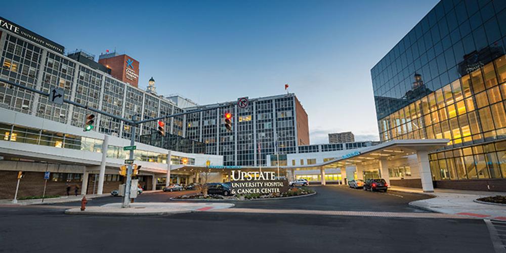 An exterior image of Upstate University Hospital and the Cancer Center.
