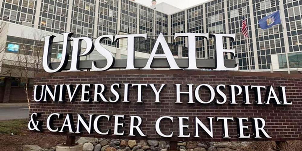 A photo of the exterior sign of Upstate University Hospital.